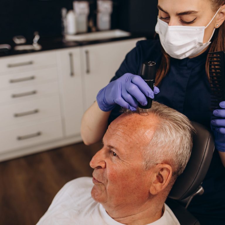 Senior man is being examined by a trichologist. Hair care concept.